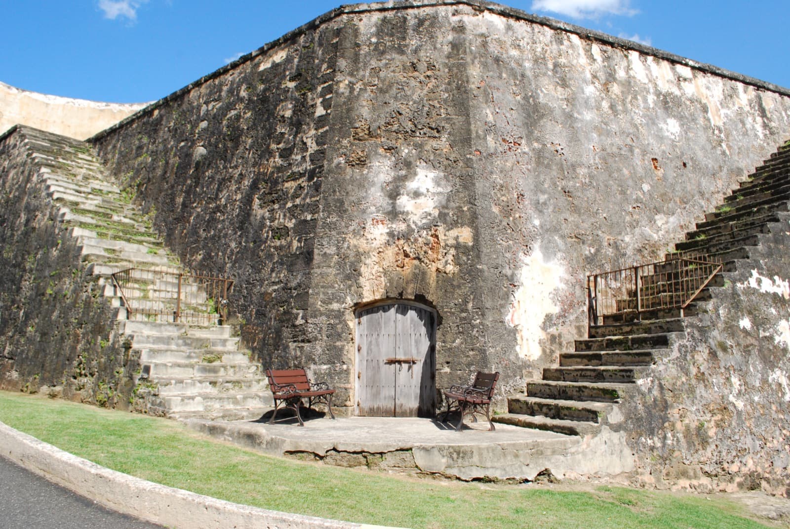 Spanish colonial fortification walls and a weathered wooden door at El Morro in San Juan, Puerto Rico